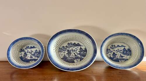 A set of three Chinese baskets and stands