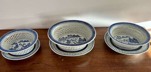 A set of three Chinese baskets and stands