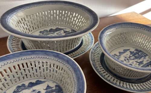A set of three Chinese baskets and stands
