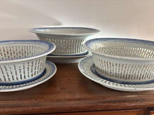 A set of three Chinese baskets and stands