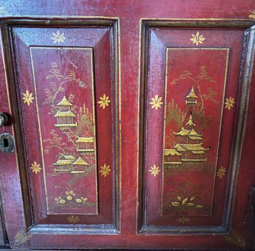 A George III red lacquer corner cabinet