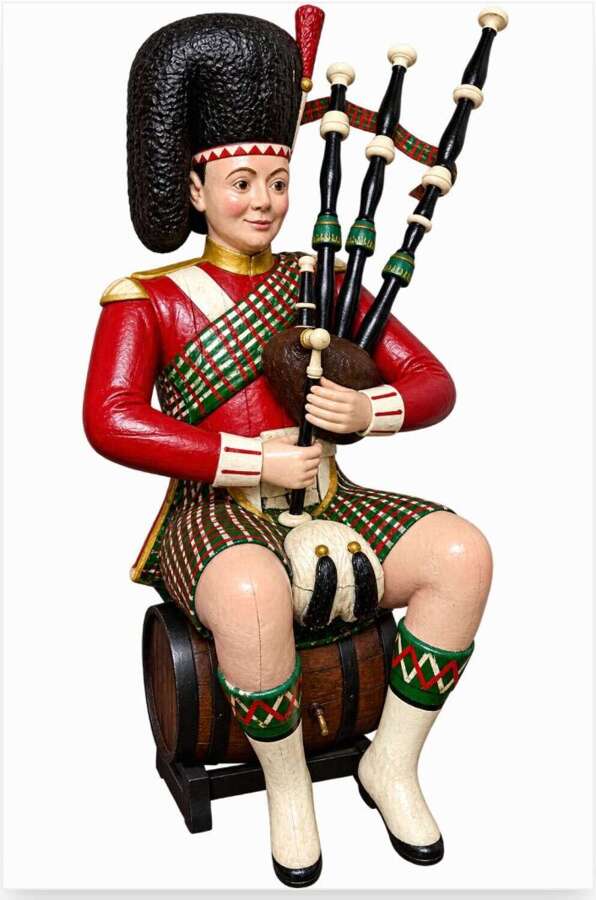 A 19th Century figure of a Bagpiper